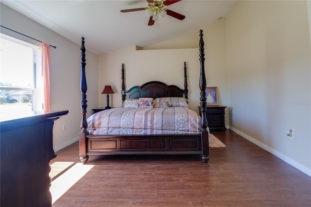 bedroom with lofted ceiling, wood finished floors, baseboards, and ceiling fan