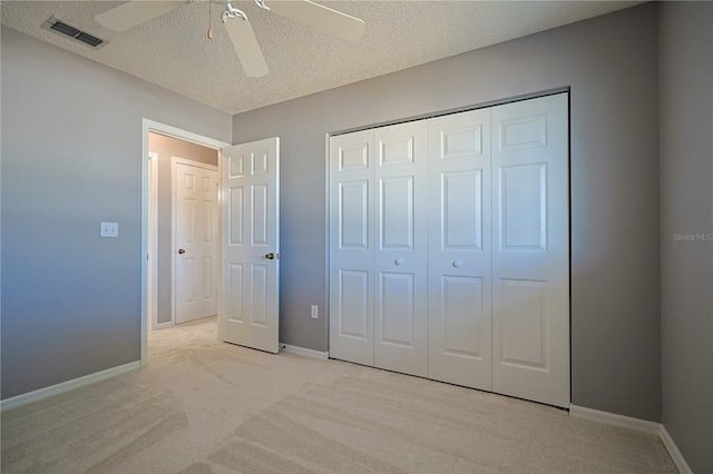 unfurnished bedroom with baseboards, visible vents, and a textured ceiling