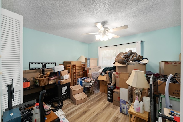 storage area with a ceiling fan