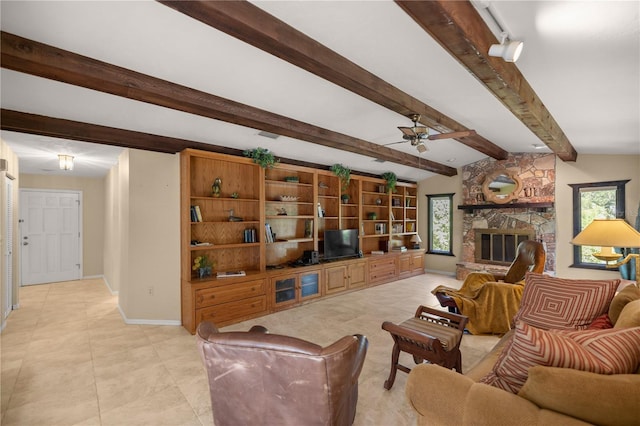 living area featuring light tile patterned floors, baseboards, a fireplace, ceiling fan, and beamed ceiling