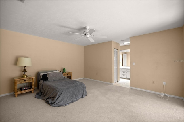 bedroom featuring baseboards, light carpet, a closet, and visible vents