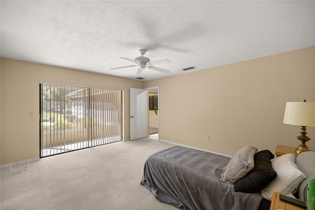 bedroom featuring baseboards, visible vents, ceiling fan, light carpet, and access to outside