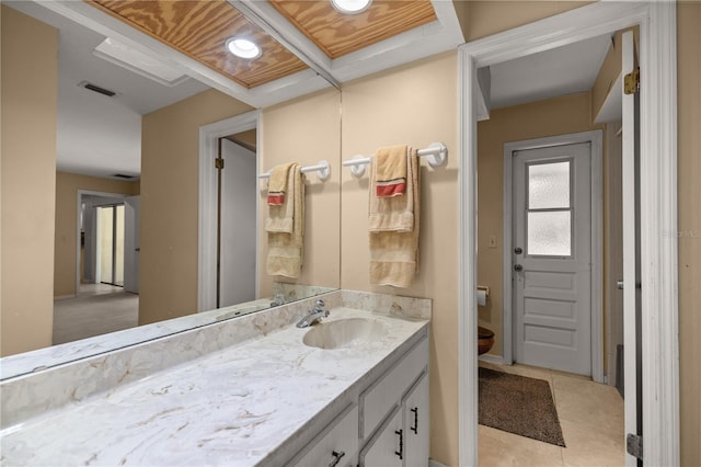 bathroom featuring vanity, tile patterned floors, toilet, and visible vents