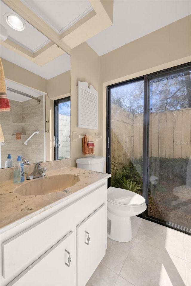 bathroom featuring tile patterned floors, toilet, and vanity