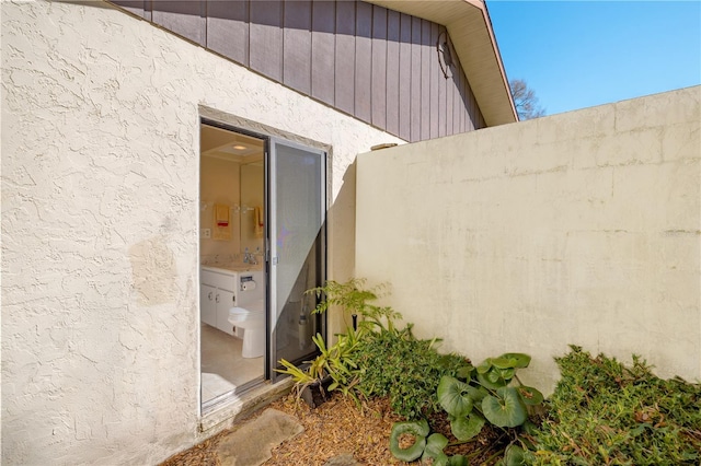 view of property exterior with stucco siding