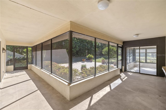 unfurnished sunroom with a healthy amount of sunlight