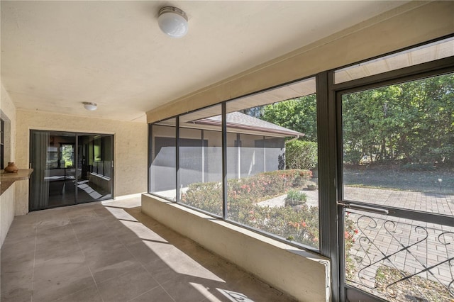 unfurnished sunroom with a healthy amount of sunlight