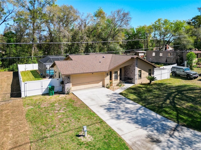 ranch-style house with driveway, a gate, a front yard, a shingled roof, and fence private yard