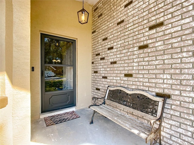 doorway to property with stucco siding