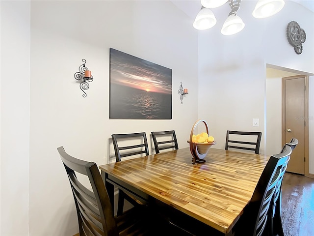 dining room featuring a notable chandelier and wood finished floors