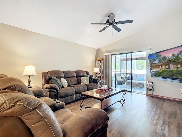 living area featuring baseboards, lofted ceiling, a ceiling fan, and wood finished floors