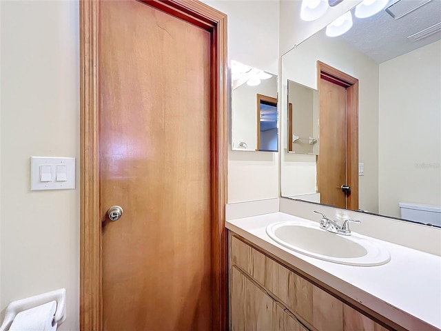 bathroom featuring visible vents and vanity