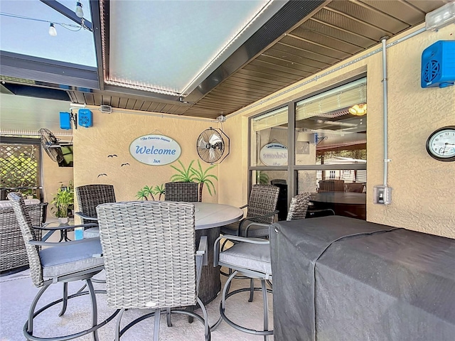 view of patio featuring outdoor dining area