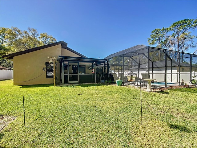 view of yard featuring a lanai and a fenced in pool