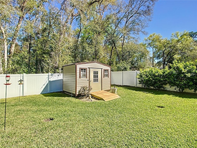 view of shed with a fenced backyard