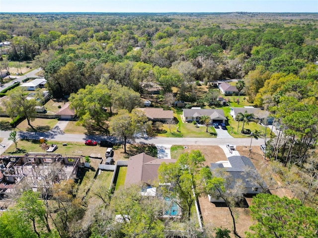 aerial view featuring a residential view and a forest view