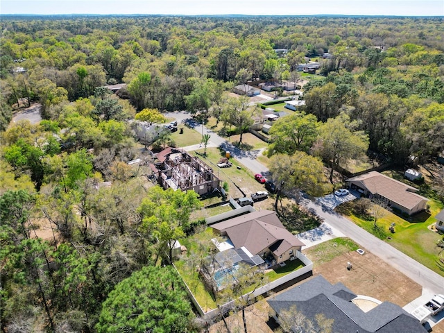 aerial view featuring a residential view and a view of trees