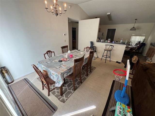 dining space featuring an inviting chandelier, baseboards, lofted ceiling, and carpet floors