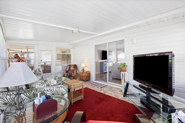 living room featuring beamed ceiling