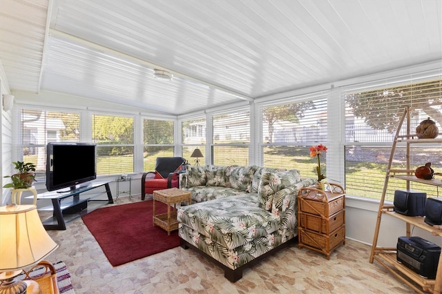 sunroom featuring vaulted ceiling