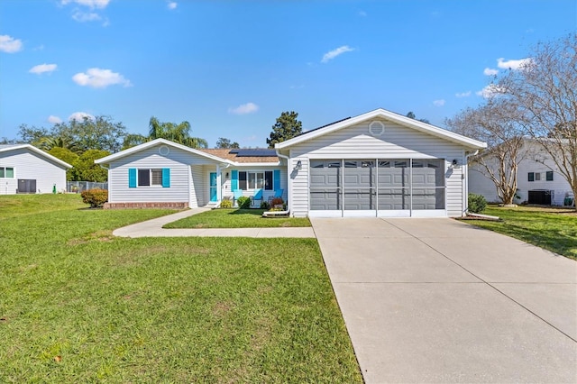 ranch-style house with a front lawn, central AC unit, and roof mounted solar panels