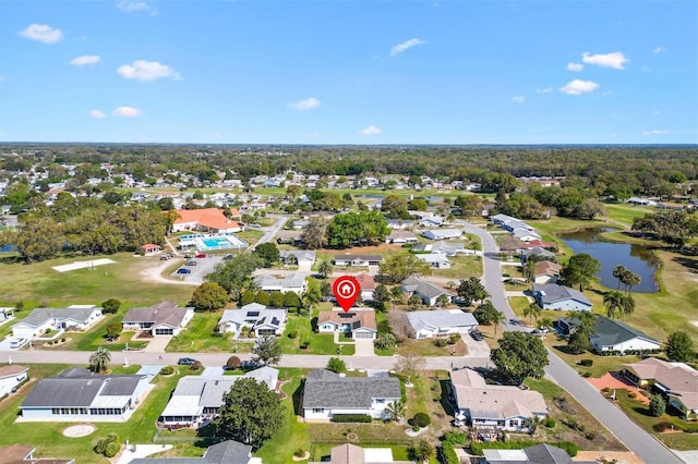 bird's eye view with a residential view and a water view