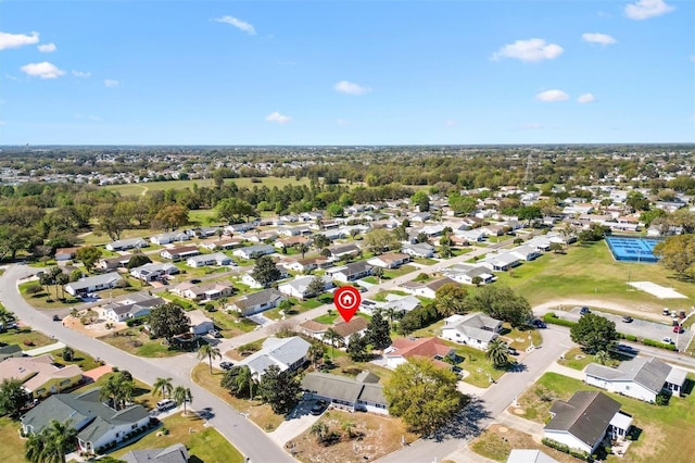 birds eye view of property with a residential view