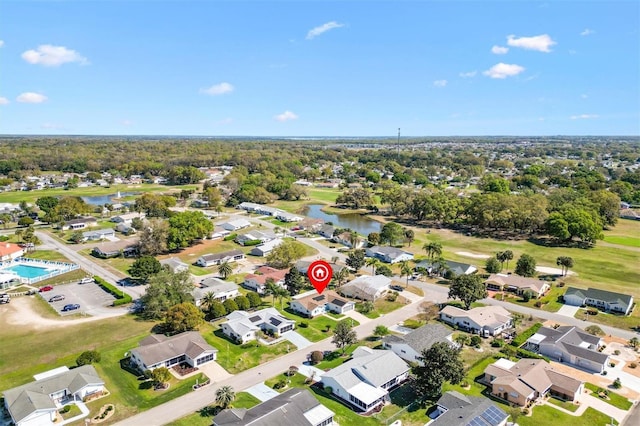 birds eye view of property with a water view and a residential view