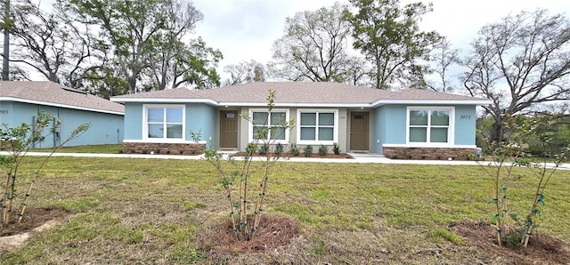 5975 NW 6th Pl, Ocala, FL 34482 - view of front of property featuring stone siding, a front yard, and stucco siding