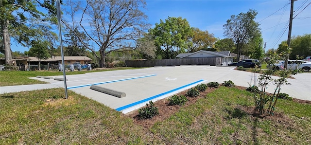5975 NW 6th Pl, Ocala, FL 34482 - exterior space with fence, uncovered parking, a yard, and basketball court