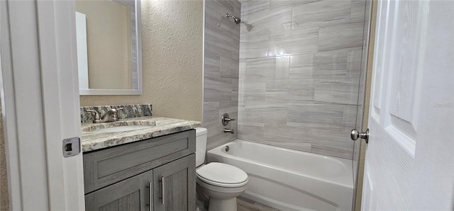 5975 NW 6th Pl, Ocala, FL 34482 - full bathroom with toilet, vanity, a textured wall, and shower / tub combination