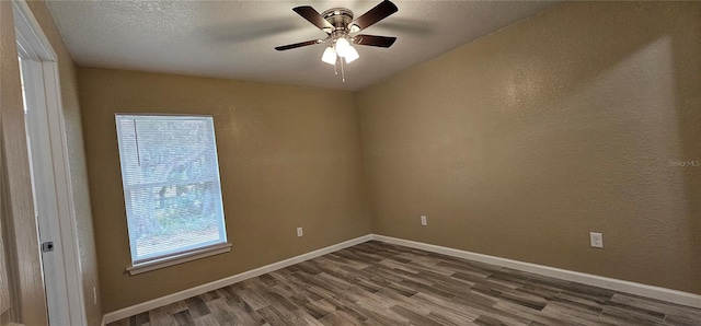 5975 NW 6th Pl, Ocala, FL 34482 - spare room with dark wood-style flooring, a textured ceiling, baseboards, ceiling fan, and a textured wall