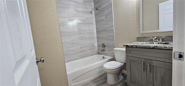5975 NW 6th Pl, Ocala, FL 34482 - bathroom with toilet, vanity, shower / washtub combination, wood finished floors, and a textured wall
