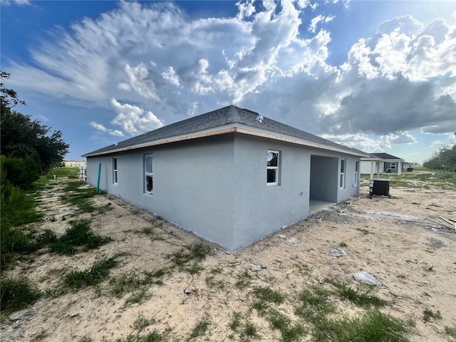 4365 SW 90th Pl, Ocala, FL 34476 - view of property exterior with stucco siding and a cooling unit