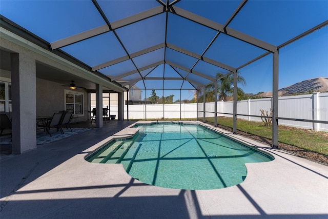 view of pool featuring a patio, fence, a fenced in pool, and a lanai