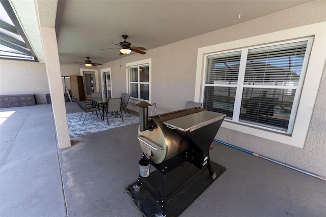 view of patio featuring outdoor dining area and ceiling fan