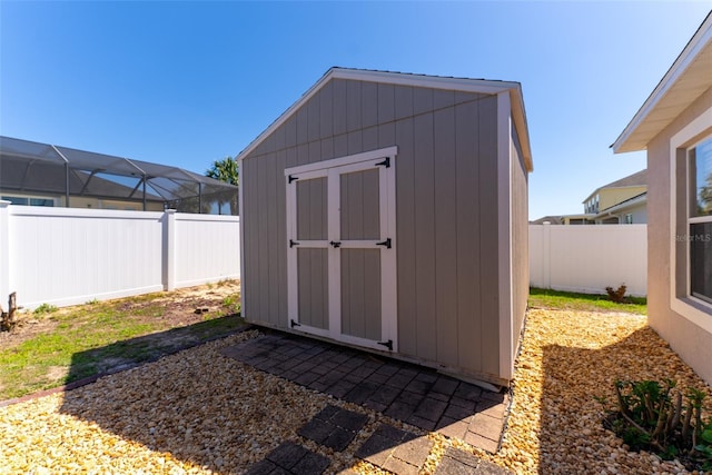 view of shed with a fenced backyard