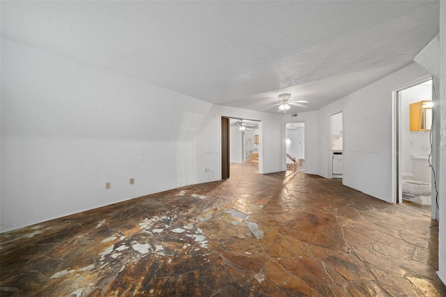 unfurnished living room with a ceiling fan