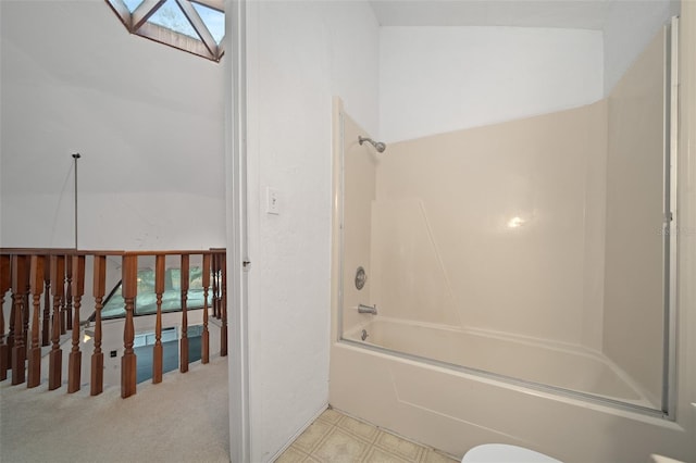 full bathroom featuring shower / washtub combination and a skylight