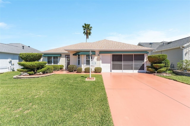 ranch-style home featuring a front yard, concrete driveway, and a garage