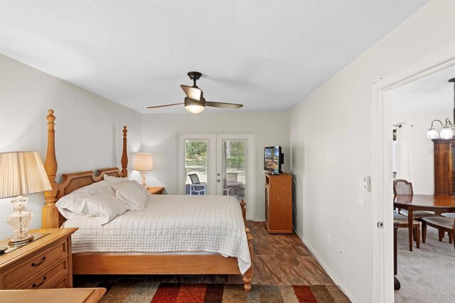 carpeted bedroom featuring ceiling fan with notable chandelier, french doors, baseboards, and access to outside