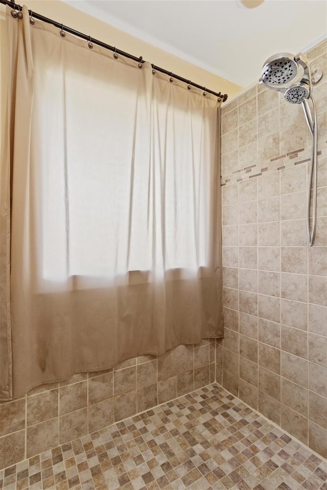 bathroom with tiled shower