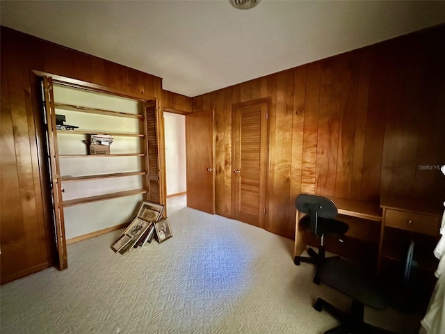 home office featuring wood walls