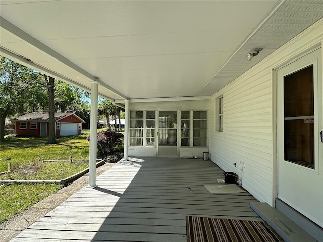 wooden deck with a lawn