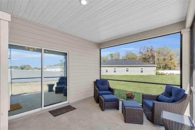 sunroom / solarium featuring a healthy amount of sunlight