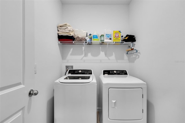 clothes washing area with laundry area and washing machine and clothes dryer