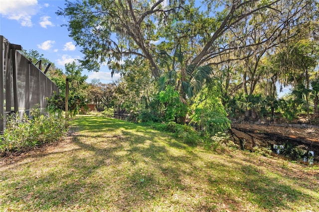 view of yard with fence