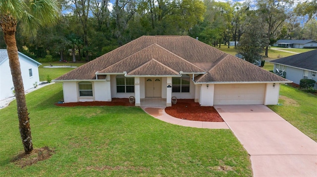 ranch-style house with stucco siding, driveway, a front yard, and a garage