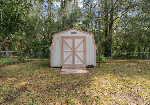 view of shed featuring a fenced backyard