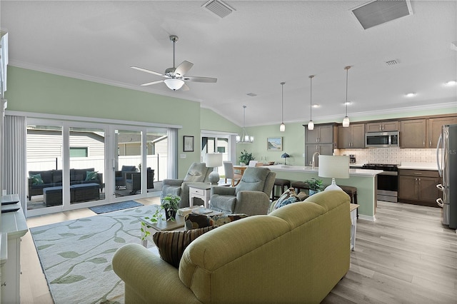 living room featuring visible vents, crown molding, and ceiling fan